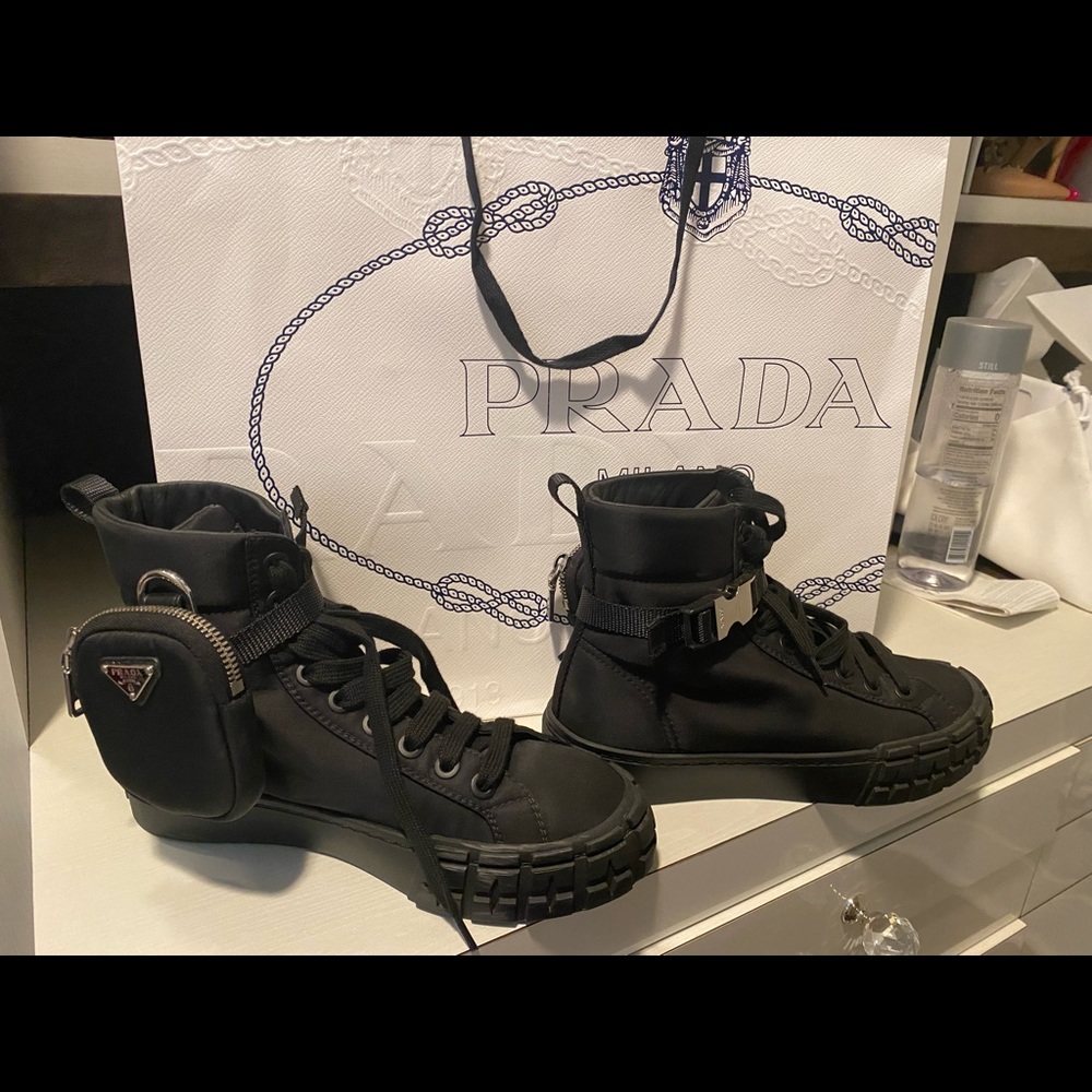 Black high top Prada shoes. Size 38. Fits 7.5. Comfy shoes. Worn about 3 times.